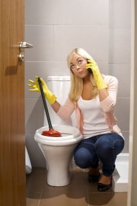 toilet-plumbing-concerned-woman
