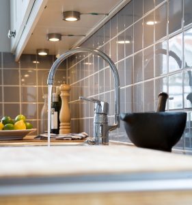 pouring-water-in-kitchen