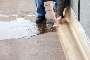 wasting water - water leaking from hole in a hose