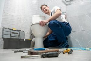 plumber-repairing-a-toilet